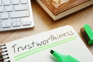 The word "trustworthiness" written on a paper