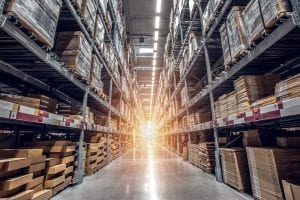 Warehouse interior showing stored inventory on shelves. 