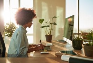 Woman adding content to a website for the google algorithm update