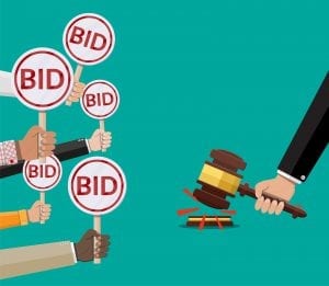 Hands holding out bid signs for pay-per-click advertising
