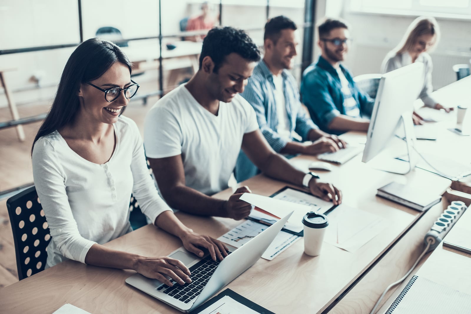 Young Smiling Business People Working In Office