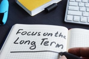 Notebook with "Focus on the Long Term" written.