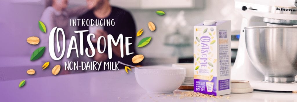 Oatsome Oat Milk on counter with bowl and mixer